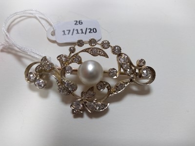 Lot 26 - A late Victorian pearl and diamond scrolling brooch