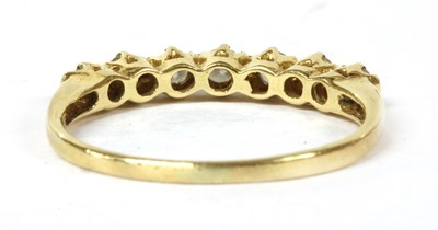 Lot 189 - A gold diamond half eternity ring