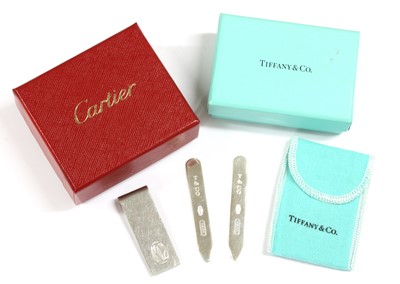 Lot 422 - A sterling silver money clip, by Cartier