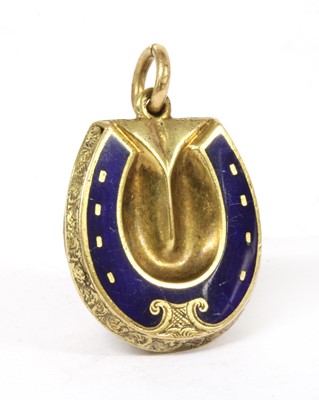 Lot 8 - A gold enamel horseshoe locket