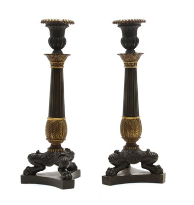 Lot 84 - A pair of Napoleon III design bronze and gilt bronze candlesticks