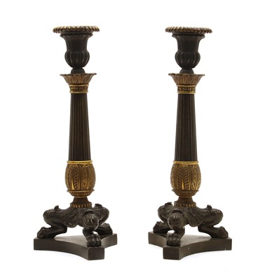 Lot 84 - A pair of Napoleon III design bronze and gilt bronze candlesticks