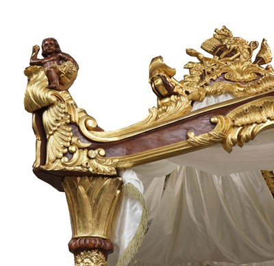 Lot 314 - A modern Baroque revival carved and gilded four post bed