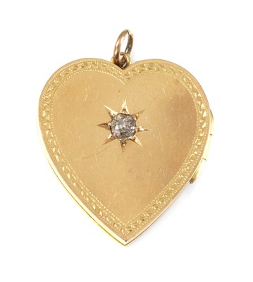 Lot 87 - An 18ct gold diamond set heart-shaped hinged locket