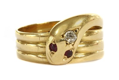 Lot 242 - An 18ct gold diamond and ruby set snake or serpent ring