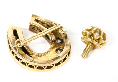Lot 22 - A gold diamond horseshoe brooch