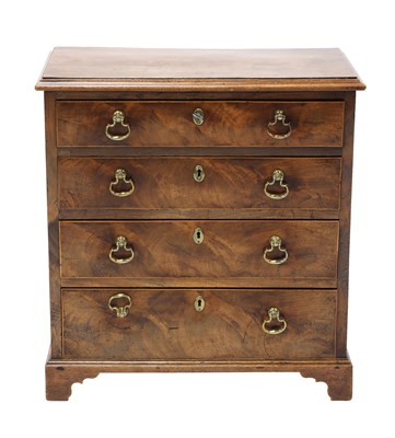 Lot 835 - A miniature mahogany chest of four long graduated drawers