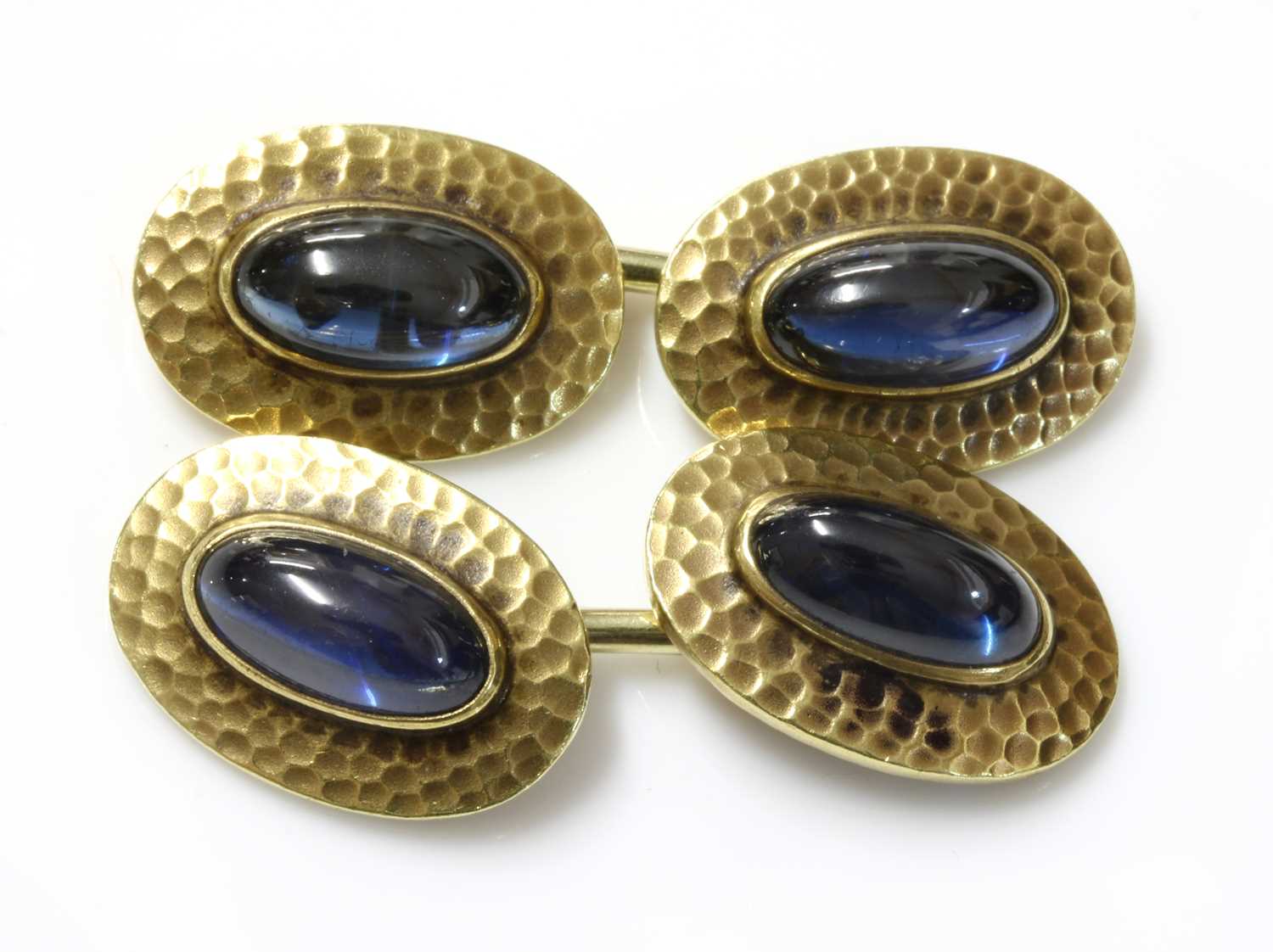 Lot 172 - A pair of gold sapphire set cufflinks