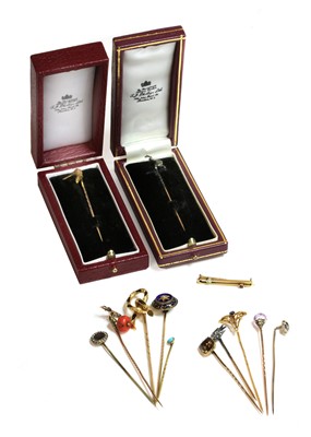 Lot 54 - A collection of 19th century stick pins and a bar brooch