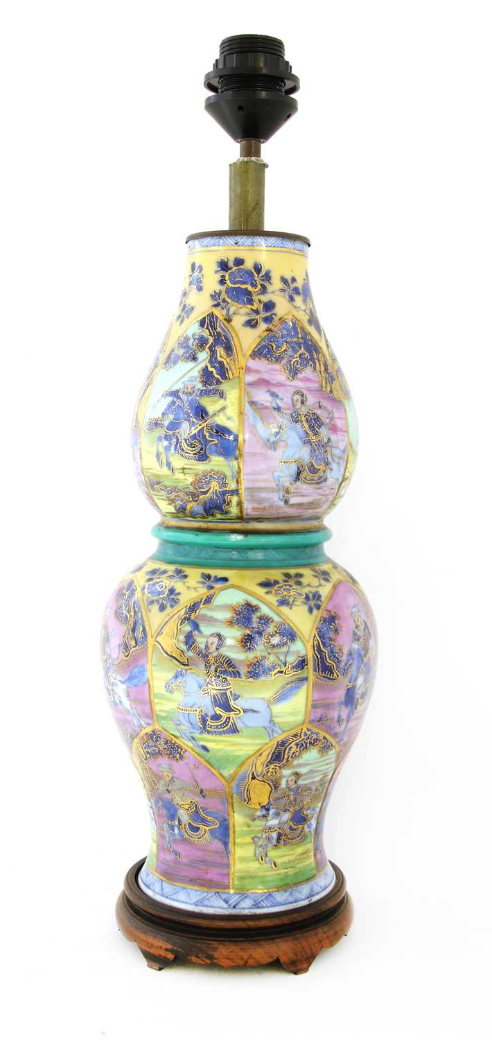 Lot 105 - A Chinese clobbered blue and white vase