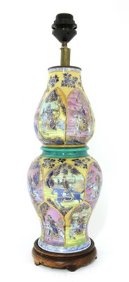 Lot 105 - A Chinese clobbered blue and white vase