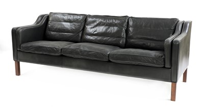 Lot 374 - A black leather three-seater sofa