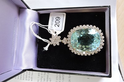 Lot 209 - An 18ct gold Paraiba tourmaline and diamond pendant