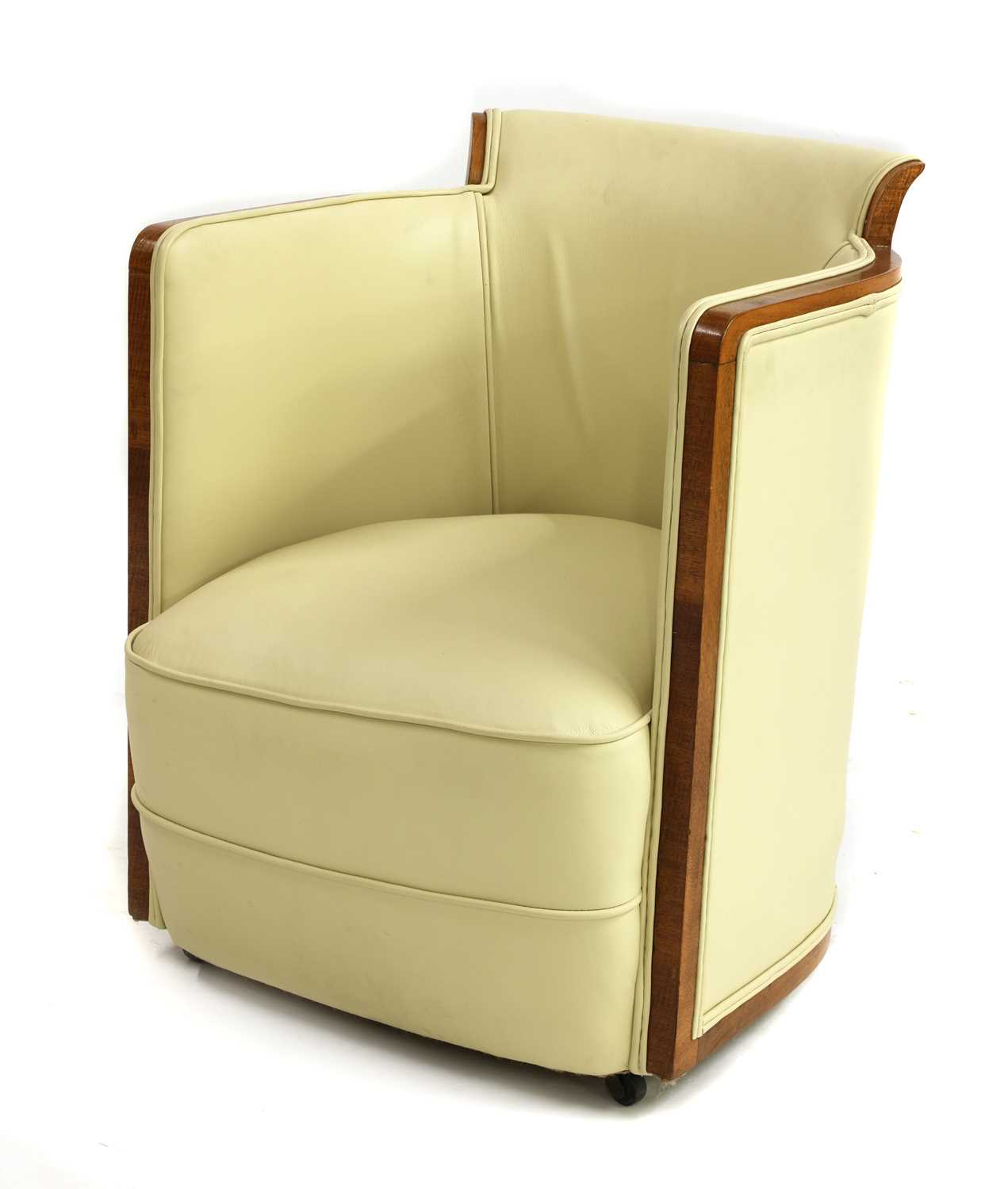 Lot 87 - An Art Deco walnut and cream leather lounge chair