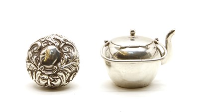 Lot 202 - A miniature silver teapot