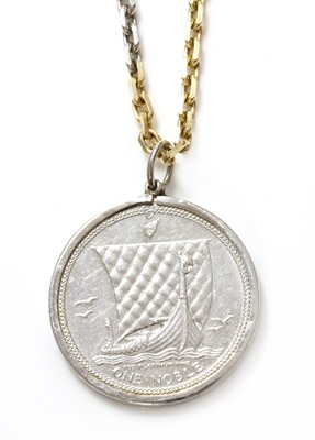 Lot 242 - A platinum and 18ct gold coin pendant with an Isle of Man one noble platinum coin