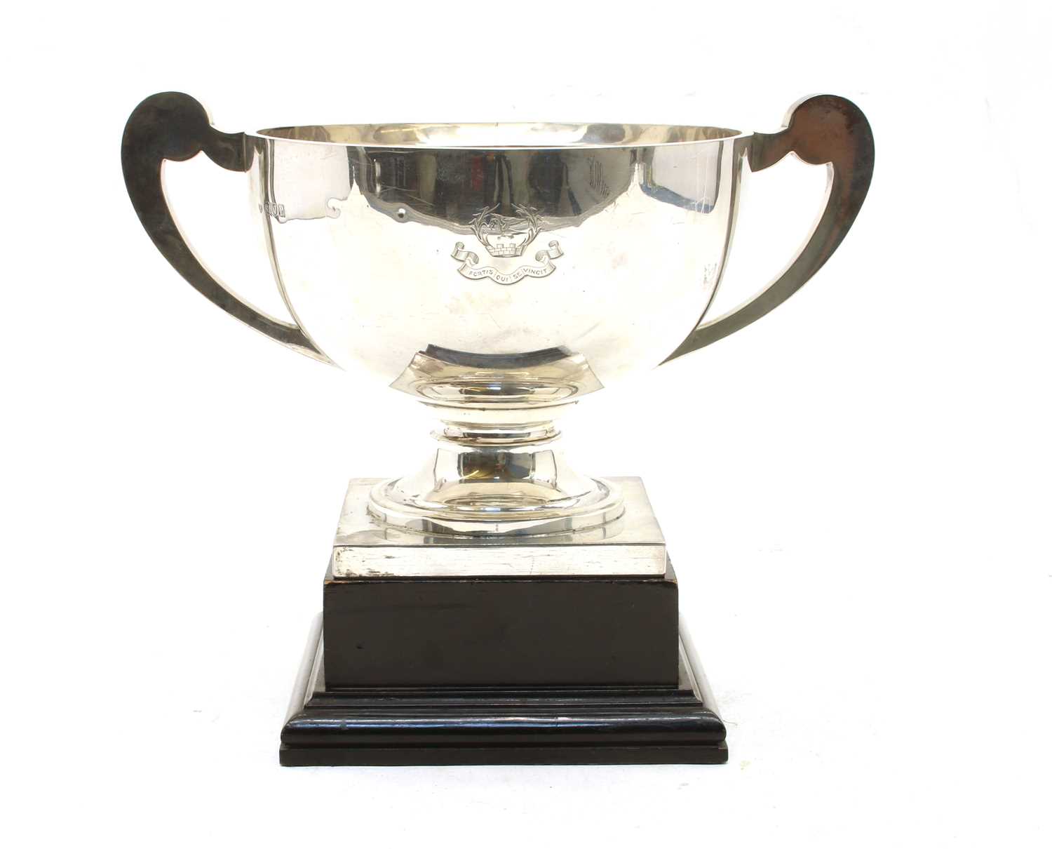 Lot 17 - A George V silver twin handled trophy with scroll handles and square plinth base