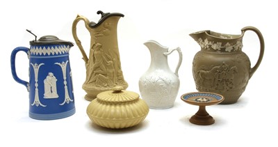 Lot 250 - A collection of seven VIctorian pottery relief-moulded jugs