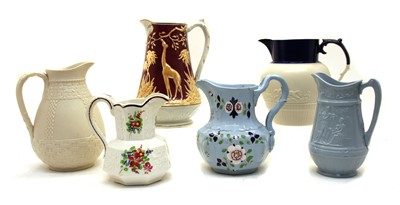 Lot 249 - A collection of thirteen Victorian and later pottery jugs