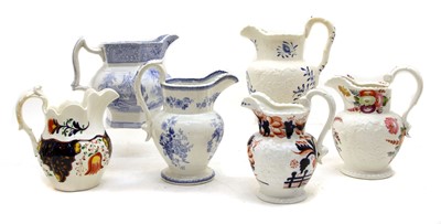 Lot 420 - A collection of thirteen various pottery jugs