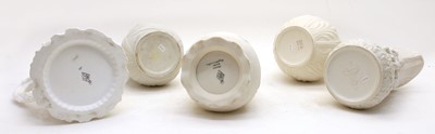 Lot 421 - A collection of five Victorian relief-moulded white stoneware jugs