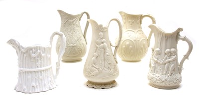 Lot 421 - A collection of five Victorian relief-moulded white stoneware jugs