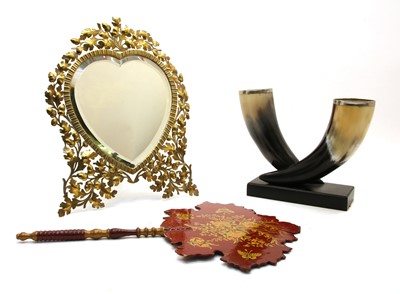 Lot 368 - A Continental brass framed heart shaped easel mirror decorated with acorns and oak leaves