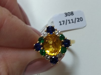 Lot 308 - An 18ct gold, yellow sapphire, blue sapphire, emerald and diamond cluster ring