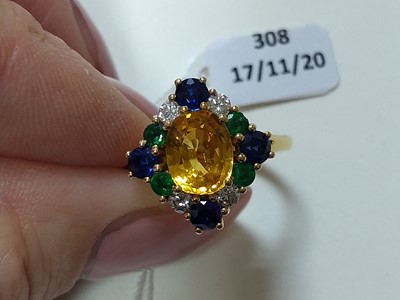 Lot 308 - An 18ct gold, yellow sapphire, blue sapphire, emerald and diamond cluster ring