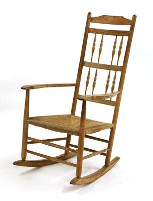 Lot 391 - An ash spindle back rocking chair