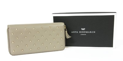 Lot 105 - An Anya Hindmarch 'Joss' leather zip around studded wallet