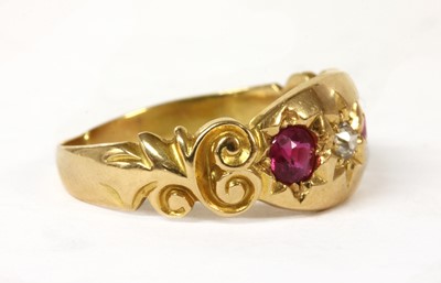 Lot 30 - An 18ct gold three stone diamond and ruby set ring