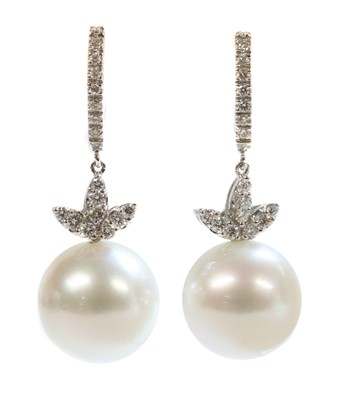 Lot 228 - A pair of Italian white gold cultured South Sea pearl and diamond drop earrings