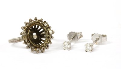 Lot 159 - A pair of 18ct white gold single stone diamond stud earrings