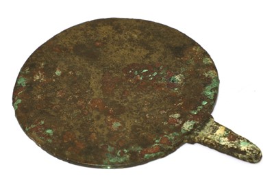 Lot 827 - A bronze and ivory mirror