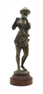 Lot 383 - A bronze of a boy shepherd playing a pipe