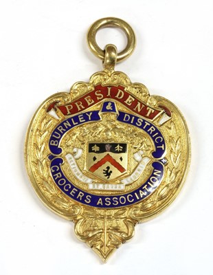 Lot 330 - A 9ct gold enamel medal