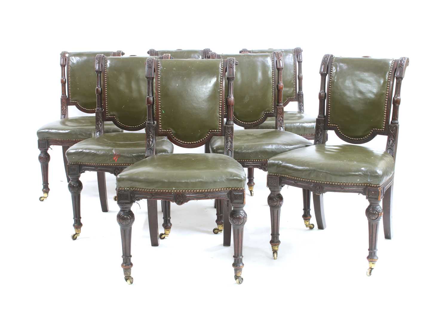 Lot 602 - A set of seven Victorian green leather upholstered dining chairs