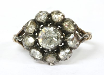 Lot 32 - A foil-backed diamond cluster ring