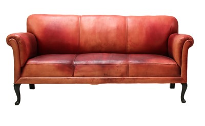 Lot 512 - A red leather three-seater settee