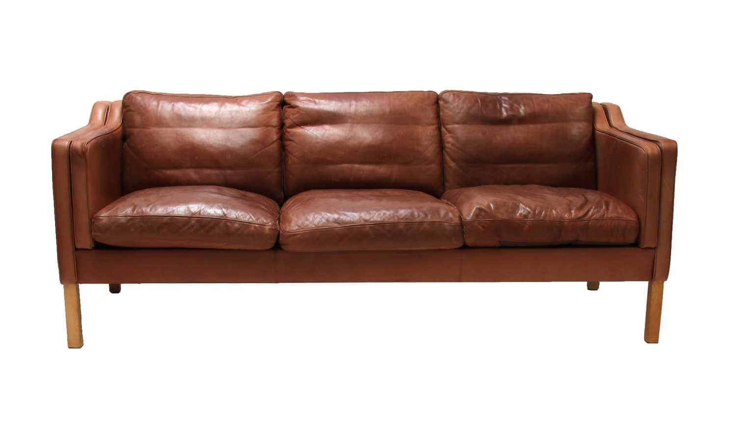 Lot 568 - A Danish brown leather three-seater settee