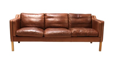Lot 568 - A Danish brown leather three-seater settee
