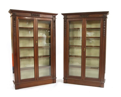 Lot 566 - A near pair of early 20th century mahogany glazed bookcases