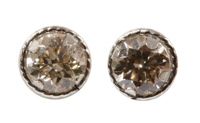Lot 156 - A pair of white gold diamond stud earrings