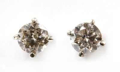 Lot 155 - A pair of 9ct white gold diamond stud earrings