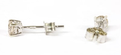 Lot 155 - A pair of 9ct white gold diamond stud earrings