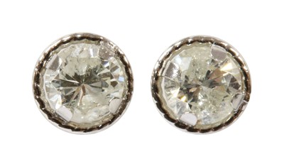 Lot 153 - A pair of white gold diamond stud earrings