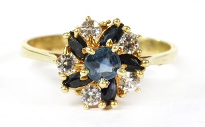 Lot 142 - A gold sapphire and paste cluster ring