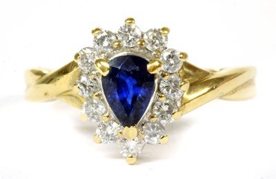 Lot 143 - A gold sapphire and diamond cluster ring