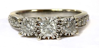Lot 109 - A white gold three stone diamond ring